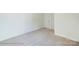 Bedroom with neutral walls and carpet floors, featuring two doors and natural light at 3242 Bozeman Ct # 8, Stanley, NC 28164