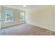 Bright, carpeted bedroom featuring two windows providing ample natural light at 3242 Bozeman Ct # 8, Stanley, NC 28164