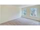 Bright bedroom with two large windows offering natural light and plush carpeting at 3242 Bozeman Ct # 8, Stanley, NC 28164