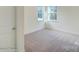 Bedroom featuring carpet floors, neutral walls, and ample natural light through two windows at 3242 Bozeman Ct # 8, Stanley, NC 28164