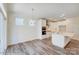 Bright kitchen and eating area with white cabinets, modern appliances, and hardwood floors at 3242 Bozeman Ct # 8, Stanley, NC 28164