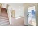 Open living room with a staircase and a view to the balcony at 3242 Bozeman Ct # 8, Stanley, NC 28164