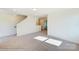 Living room with staircase and bright natural light at 3242 Bozeman Ct # 8, Stanley, NC 28164