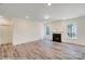 Inviting living area features luxury vinyl plank flooring, freshly painted walls, and a cozy fireplace at 3242 Bozeman Ct # 8, Stanley, NC 28164