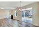 Bright living room with hardwood floors, a fireplace, and a sliding glass door leading to the patio at 3242 Bozeman Ct # 8, Stanley, NC 28164
