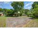 Outdoor basketball court with backboard and lush green yard in a residential setting at 3624 Delgany Dr, Charlotte, NC 28215