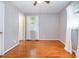 Clean bedroom with hardwood floors, a ceiling fan, and plenty of natural light from the window at 3624 Delgany Dr, Charlotte, NC 28215