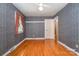 Bedroom featuring wood floors, a ceiling fan, and a doorway leading to another room at 3624 Delgany Dr, Charlotte, NC 28215