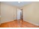 Cozy bedroom with hardwood floors, neutral walls, closet and ceiling fan at 3624 Delgany Dr, Charlotte, NC 28215