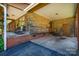 Enclosed carport area showcasing a wooden support structure and a brick base at 3624 Delgany Dr, Charlotte, NC 28215