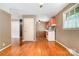 Eat-in kitchen with hardwood floors, vintage appliances, and direct access to living spaces at 3624 Delgany Dr, Charlotte, NC 28215
