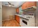 Functional kitchen featuring linoleum floors, classic appliances, and practical storage solutions at 3624 Delgany Dr, Charlotte, NC 28215