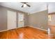 Open-concept living area with hardwood floors and wallpapered accents, with multiple doorways, lots of room at 3624 Delgany Dr, Charlotte, NC 28215