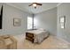 Neutral bedroom offering single bed, carpeted floor, side table, overhead lighting, and window with privacy shades at 4211 Maggie Springs Way, Clover, SC 29710