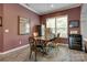 Dining room featuring a table, chairs, wine cooler, and natural light from a large window at 4211 Maggie Springs Way, Clover, SC 29710