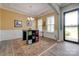 Dining room with decorative wainscoting, light hardwood flooring, recessed ceiling with chandelier, and sliding door access at 4211 Maggie Springs Way, Clover, SC 29710