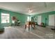 Spacious game room with natural light, foosball table, and a vintage pinball machine at 4211 Maggie Springs Way, Clover, SC 29710