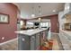 Bright kitchen with a large island, stainless steel appliances, and an open layout connecting to the living room at 4211 Maggie Springs Way, Clover, SC 29710