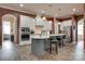 Stylish kitchen offering island with seating, stainless steel appliances, recessed lights, tile backsplash, and hardwood floors at 4211 Maggie Springs Way, Clover, SC 29710