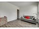 Comfortable living room with gray sofa, wood floors and natural light at 4211 Maggie Springs Way, Clover, SC 29710