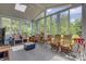 Bright sunroom featuring multiple windows providing beautiful views of surrounding greenery at 4211 Maggie Springs Way, Clover, SC 29710