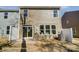The backyard features a quaint brick patio area that is located directly outside the back door, perfect for relaxation at 4254 Black Ct # 231, Harrisburg, NC 28075