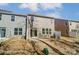 A backyard showcasing a brick patio and grassy area, highlighting the outdoor living space for relaxation and entertainment at 4254 Black Ct # 231, Harrisburg, NC 28075