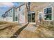 The backyard features a brick patio, and grass with a view of the fence to the neighboring homes at 4254 Black Ct # 231, Harrisburg, NC 28075