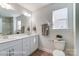 Bathroom featuring double sinks, modern fixtures and a tile floor at 4254 Black Ct # 231, Harrisburg, NC 28075