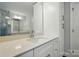 A modern bathroom with white cabinetry, quartz countertops, and chrome fixtures at 4254 Black Ct # 231, Harrisburg, NC 28075