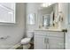 Clean bathroom with white cabinetry, modern fixtures, and stylish decor at 4254 Black Ct # 231, Harrisburg, NC 28075