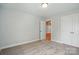 Bedroom featuring carpet, neutral paint, and a doorway at 4254 Black Ct # 231, Harrisburg, NC 28075