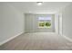 Neutral bedroom with carpet flooring and a large window at 4254 Black Ct # 231, Harrisburg, NC 28075