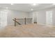 Large bonus room with carpet and staircase with metal railings and a hallway at 4254 Black Ct # 231, Harrisburg, NC 28075