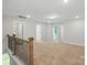 Large bonus room with carpet and a staircase with metal railings at 4254 Black Ct # 231, Harrisburg, NC 28075