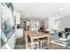 Dining area with a wooden table, comfortable chairs, leading to the living room and kitchen at 4254 Black Ct # 231, Harrisburg, NC 28075