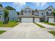 Charming townhome with stone accents, a two-car garage, and well-manicured lawn at 4254 Black Ct # 231, Harrisburg, NC 28075