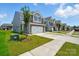 Street view of the townhomes showcasing well-maintained lawns and modern architectural design at 4254 Black Ct # 231, Harrisburg, NC 28075