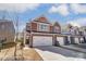 New two-story townhome featuring brick accents, white garage door, and a manicured lawn at 4254 Black Ct # 231, Harrisburg, NC 28075