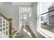 Bright foyer with white trim, wood-look floors, and a large window offering natural light at 4254 Black Ct # 231, Harrisburg, NC 28075