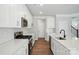Modern kitchen featuring white cabinets, stainless steel appliances, and quartz countertops at 4254 Black Ct # 231, Harrisburg, NC 28075