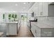 Modern kitchen featuring stainless steel appliances, white countertops, and ample cabinet space at 4254 Black Ct # 231, Harrisburg, NC 28075