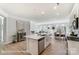 Modern kitchen with island flowing into a living and dining area with lots of light at 4254 Black Ct # 231, Harrisburg, NC 28075