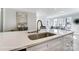 Open kitchen featuring quartz countertops, stainless steel appliances, and modern fixtures at 4254 Black Ct # 231, Harrisburg, NC 28075