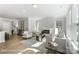 Bright living room featuring a modern fireplace, large windows, and elegant decor at 4254 Black Ct # 231, Harrisburg, NC 28075