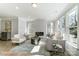 Bright living room featuring a modern fireplace, large windows, and elegant decor at 4254 Black Ct # 231, Harrisburg, NC 28075