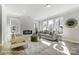 Bright living room featuring a fireplace, large windows, and stylish furniture at 4254 Black Ct # 231, Harrisburg, NC 28075