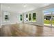 Light-filled living area with hardwood floors and access to the backyard at 4254 Black Ct # 231, Harrisburg, NC 28075