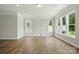 Bright living room with hardwood floors and large windows at 4254 Black Ct # 231, Harrisburg, NC 28075