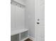 Mudroom with built-in bench with hooks and storage with light gray walls at 4254 Black Ct # 231, Harrisburg, NC 28075